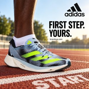 Adidas ADIZERO TAKUMI SEN 9 running IG3132 — Adult runner in black shorts standing in controlled forward starting stance jus…
