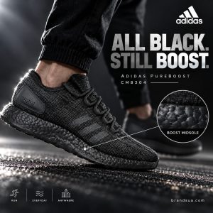 Adidas Pure Boost Triple Black CM8304 — Bright rimlight reveals actual foam texture in allblack design.
