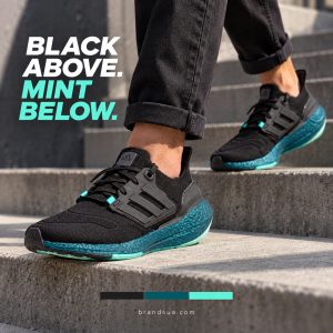 Adidas Ultraboost 22 GX5564 — Adult walking down clean concrete steps, rolled dark trousers, shoe fully visible; slim horizo…