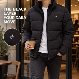 Calvin Klein winter new waterproof — Adult neck-to-thigh stepping from cafe doorway with takeaway cup, exact black jacket pa…