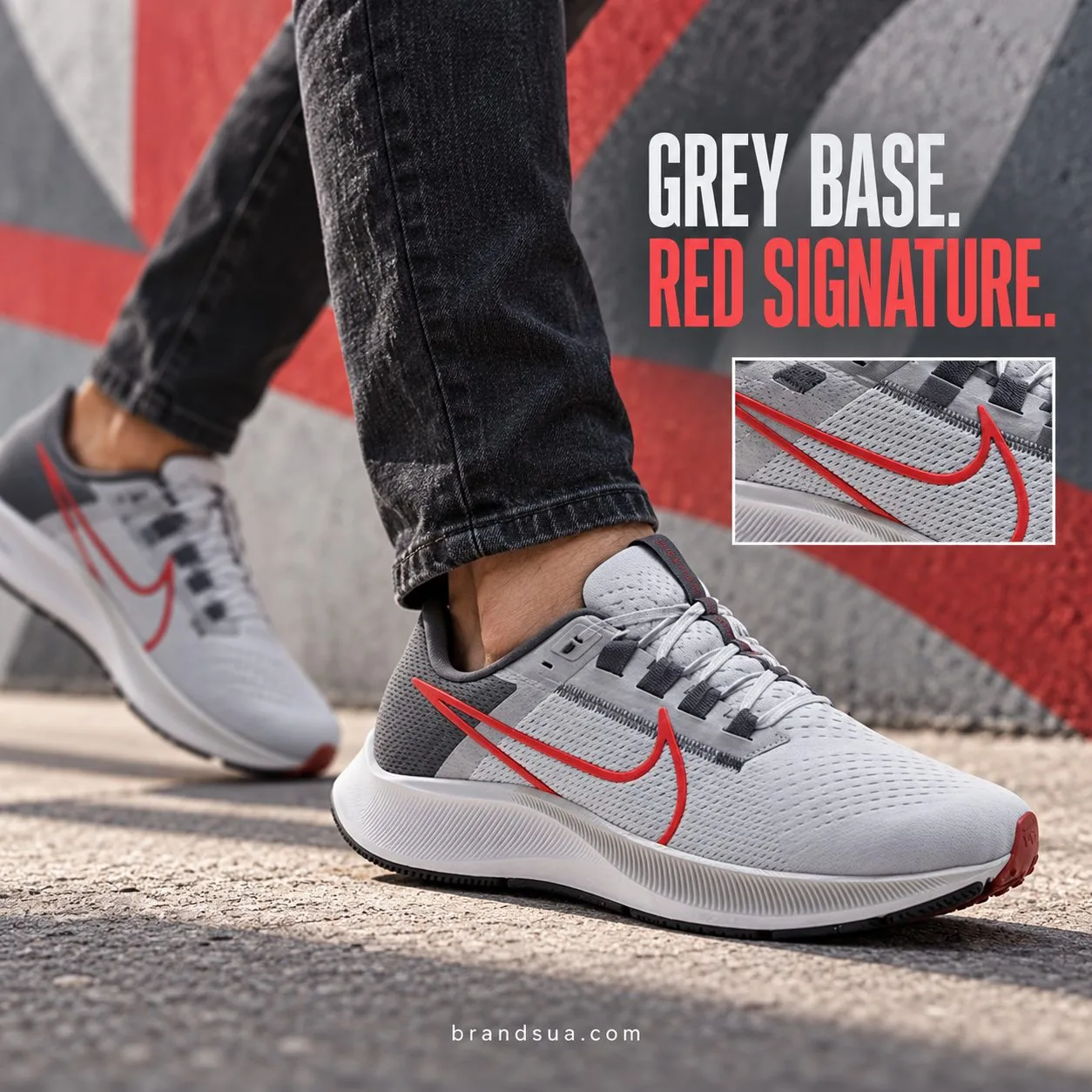 NIKE Air Zoom Pegasus 38 CW7356-200 — Cropped adult walks beside urban mural made only of abstract red/grey shapes, dark jea…