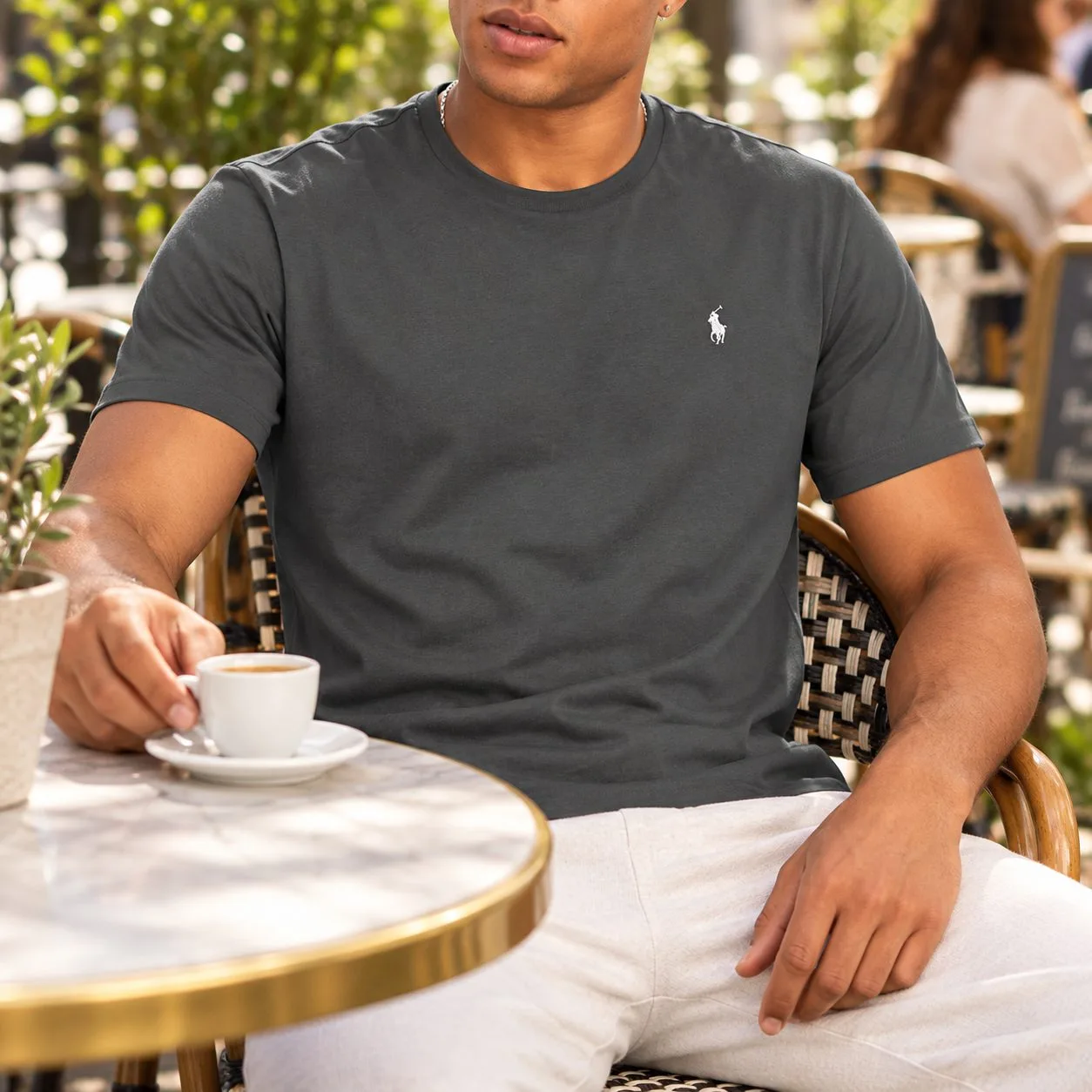 Polo Ralph Lauren shirt — Dark grey size L — dark grey T-shirt worn at an outdoor cafe