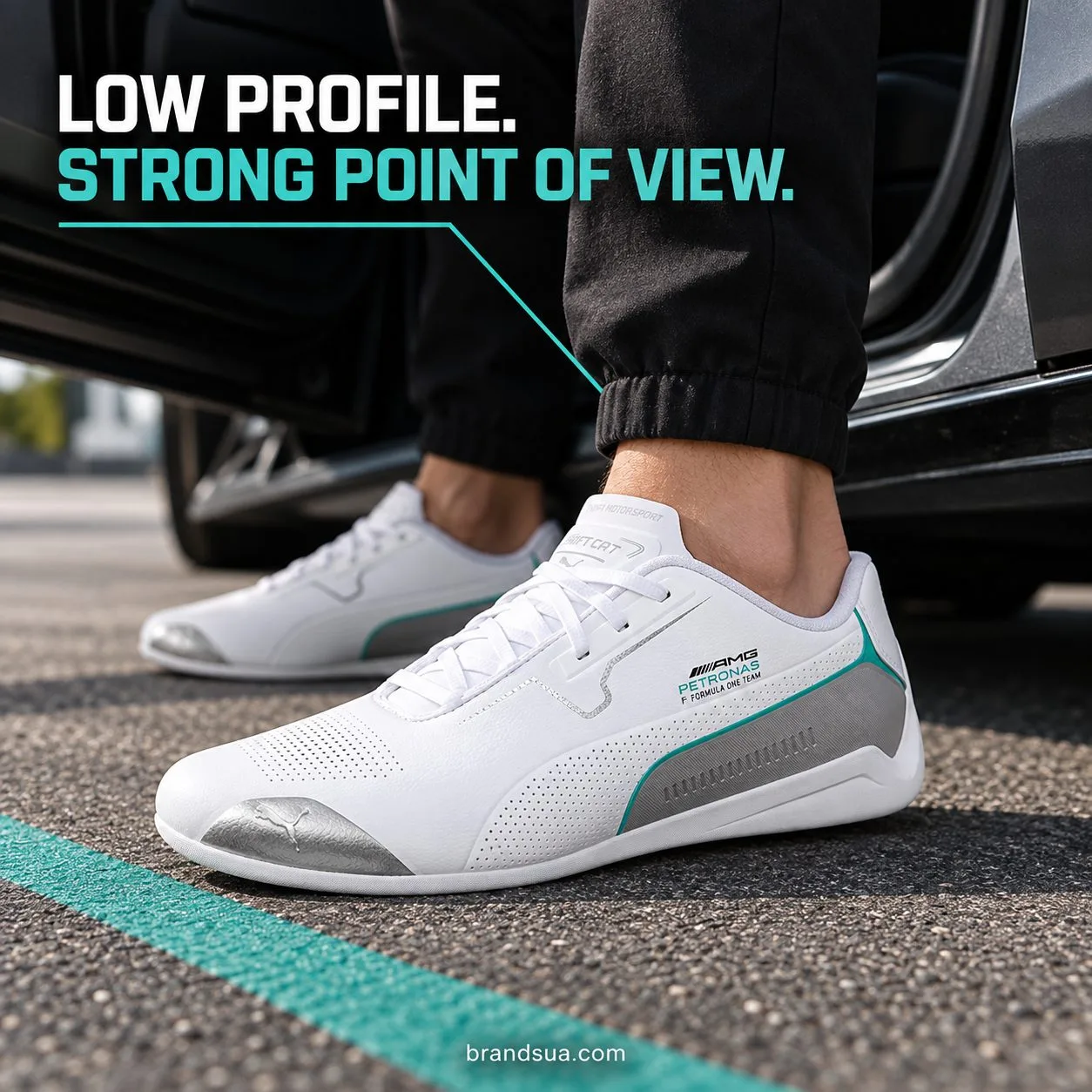 Puma mercedes Drift cat 8 white — Adult steps from parked car onto dry pavement, body cropped, actual shoe side-profile shar…